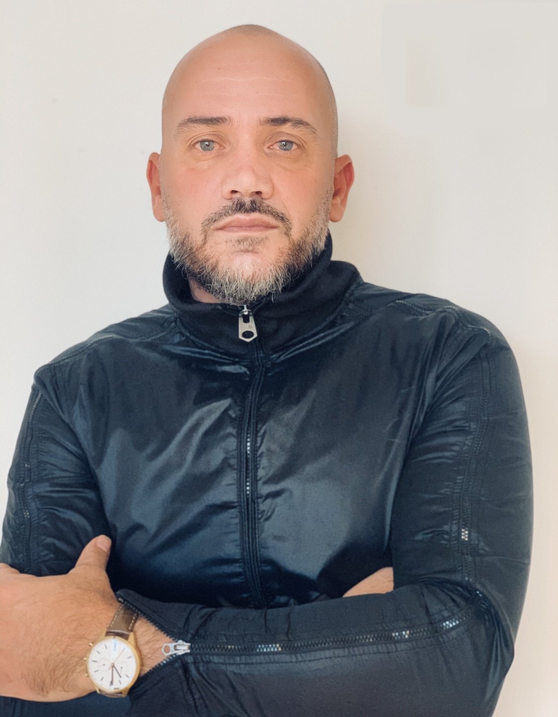 Asher Barmoha, arms folded, in a black zip jacket