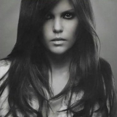 Black and white editorial portrait with long dark hair